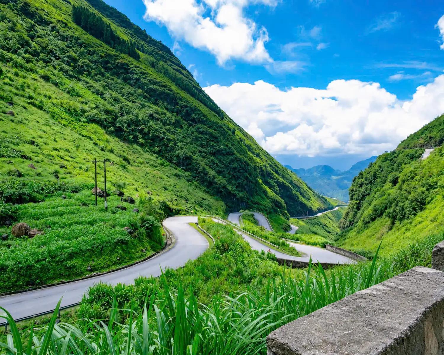 Winding mountain road through Ha Giang karst peaks