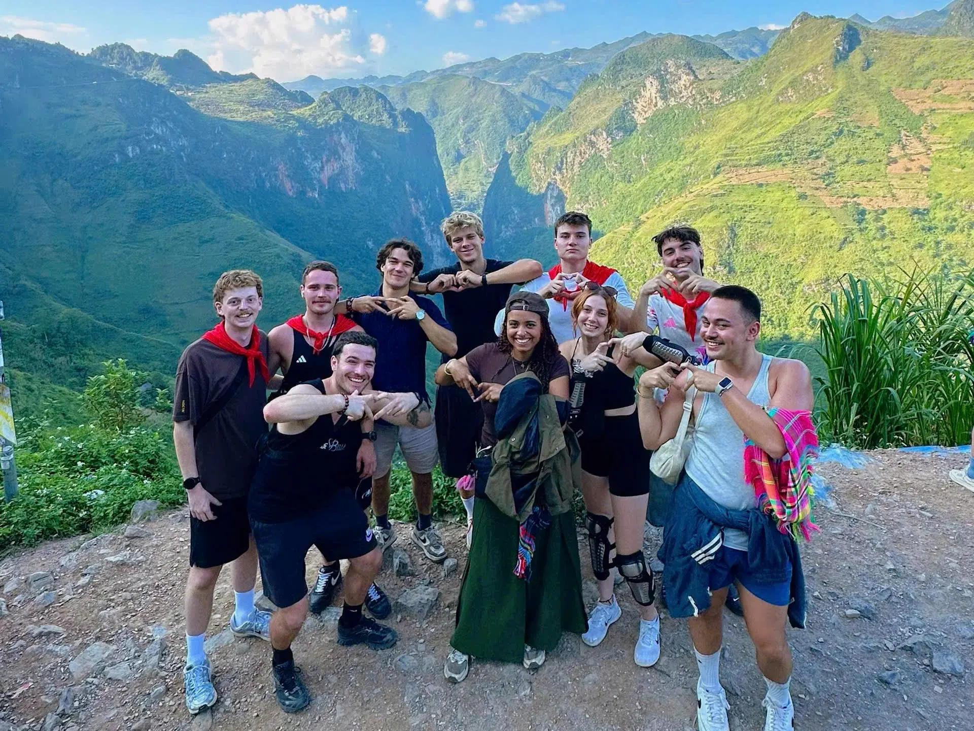 Travelers together at a mountain viewpoint on the Ha Giang Loop